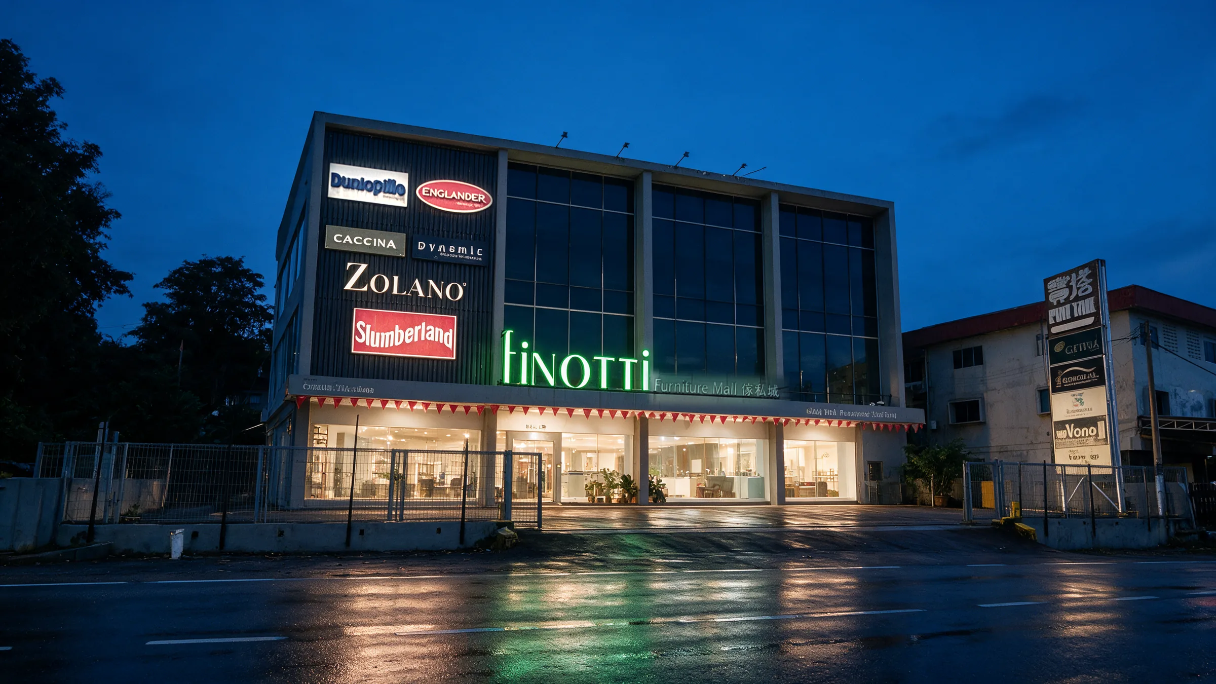 The Finotti shopfront at blue hour, signboard and showroom lit, reflections on the wet road